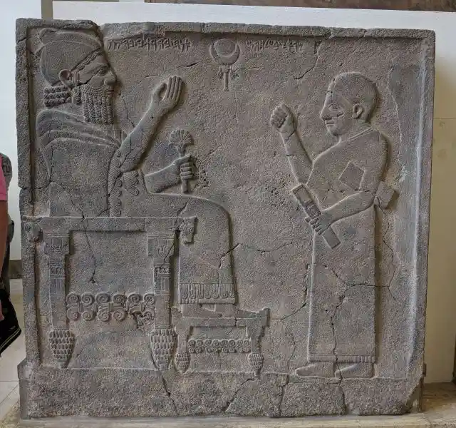 A royal scribe with writing board and stylus case in front of his King Barrakib, Pergamon Museum, Museum Island, Berlin